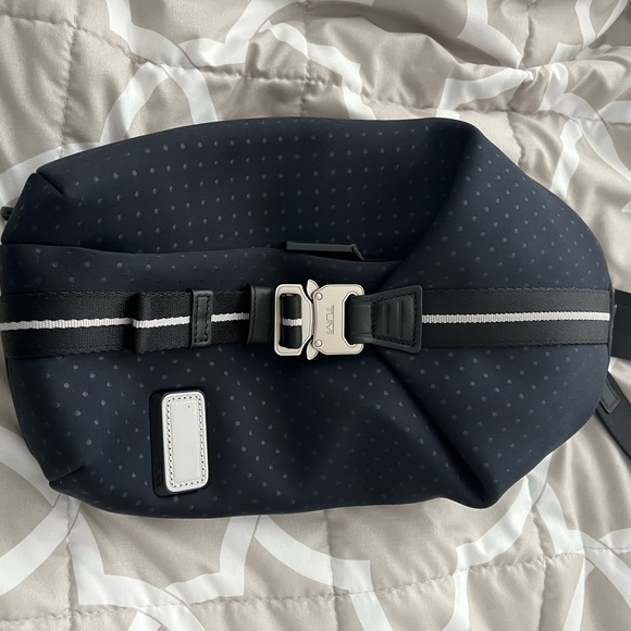 Tumi Bozeman blue Sling bag.Unisex